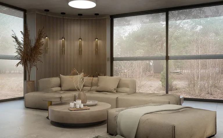 Nowoczesny salon w stylu boho i skandynawskim z beżową sofą i drewnianymi elementami.