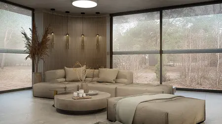 Nowoczesny salon w stylu boho i skandynawskim z beżową sofą i drewnianymi elementami.
