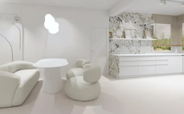 Nowoczesne wnętrze w stylu boho i japandi z białą sofą i marmurowym blatem.