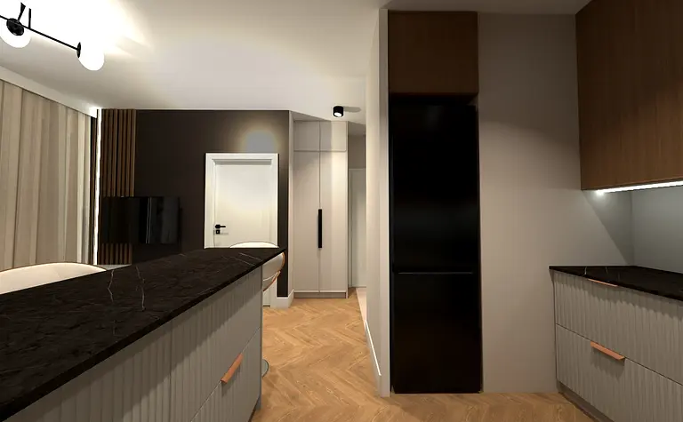 Wnętrze kuchni z ciemnymi szafkami i jasnym blatem w stylu współczesnym.