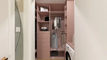 Garderoba w stylu art deco i boho z różowymi szafkami i pralką.