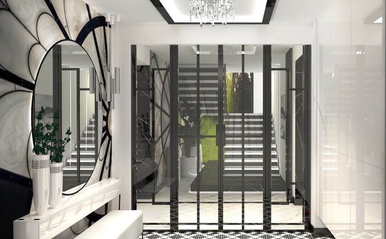 Przedpokój w stylu art deco i glamour z czarną podłogą i dużym lustrem.
