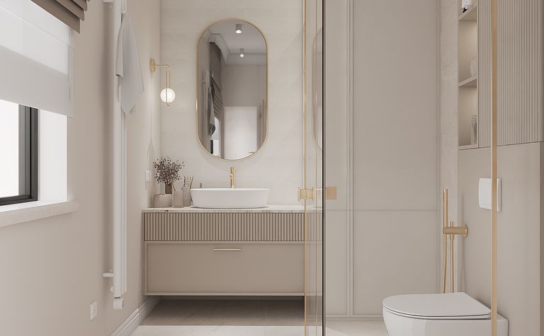 Wnętrze łazienki w stylu minimaluxe z nowoczesnymi elementami i złotymi akcentami.