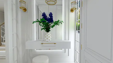 Przedpokój z białą konsolą, złotymi lampami i kwiatami w wazonie. Styl glamour i współczesny.