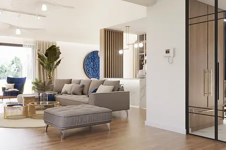 Wnętrze salonu z szarym wyposażeniem i złotymi detalami, nowoczesny design.