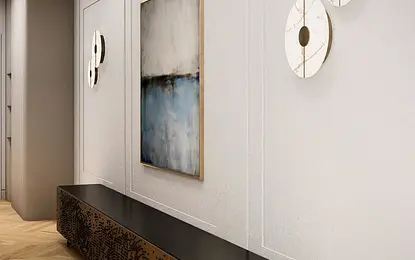 Wnętrze przedpokoju z minimalistycznym designem, nowoczesnym oświetleniem oraz dekoracjami.