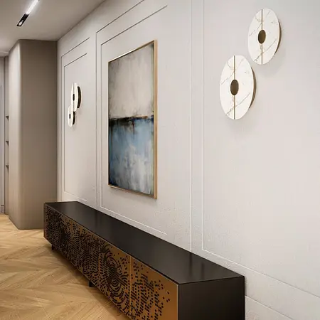 Wnętrze przedpokoju z minimalistycznym designem, nowoczesnym oświetleniem oraz dekoracjami.