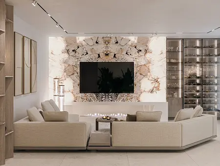 Wnętrze nowoczesnego salonu z jasnymi meblami i kamienną ścianą w stylu quiet luxury.