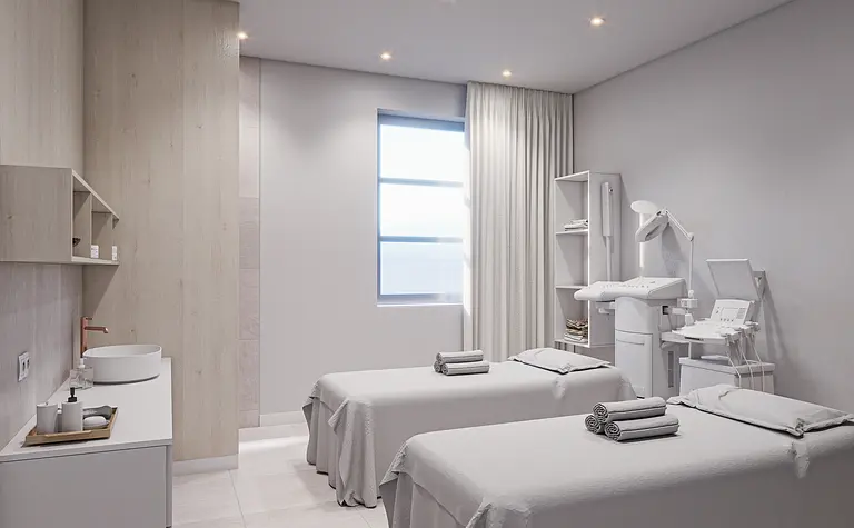 Wnętrze gabinetu z białymi meblami, drewnianymi detalami, minimalistyczne i nowoczesne.