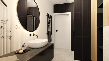 Nowoczesna łazienka z dużym okrągłym lustrem, minimalistycznymi meblami i industrialnym akcentem.