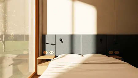 Wnętrze sypialni w stylu japandi i minimalistycznym z dużymi oknami