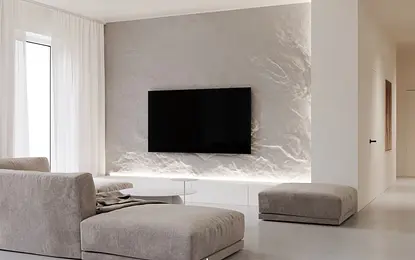 Nowoczesny salon w minimalistycznym stylu z szarymi meblami i białymi akcentami.