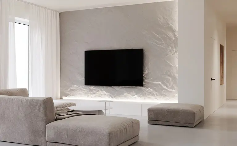 Nowoczesny salon w minimalistycznym stylu z szarymi meblami i białymi akcentami.