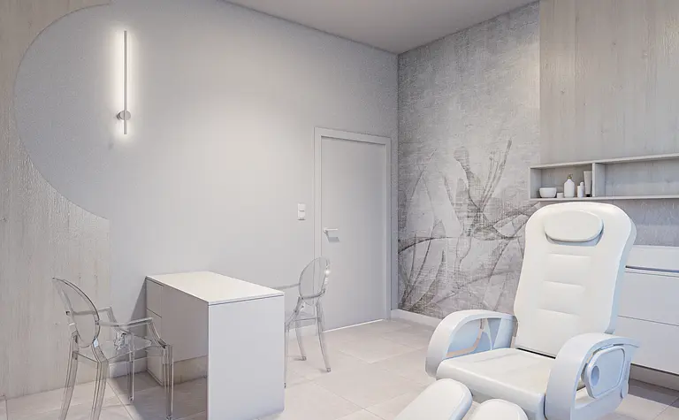 Wnętrze minimalistycznego gabinetu z białym fotelem oraz nowoczesnym biurkiem.