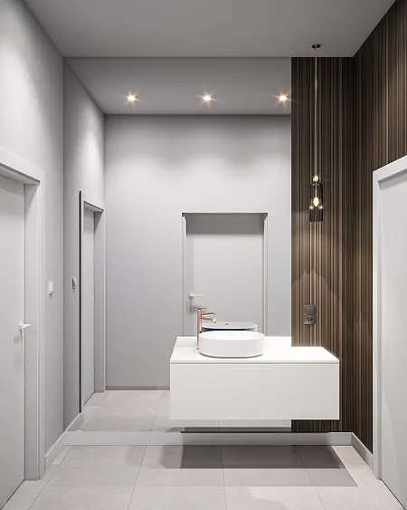 Minimalistyczna łazienka z białą umywalką i nowoczesnymi akcentami.