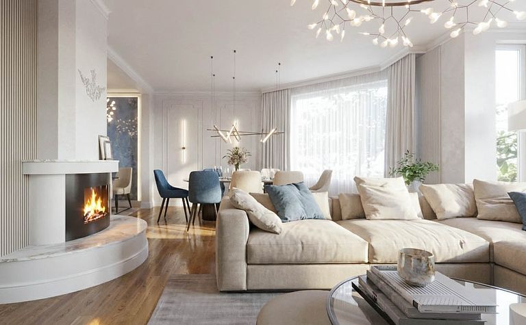 Wnętrze salonu z kominkiem, jasnymi meblami i akcentami quiet luxury.