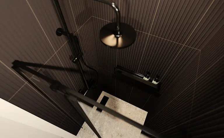 Nowoczesna łazienka z czarnymi płytkami i minimalistycznymi elementami