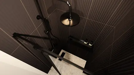 Nowoczesna łazienka z czarnymi płytkami i minimalistycznymi elementami