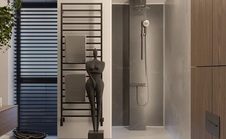 Nowoczesna łazienka z minimalistycznym wystrojem, szarymi i czarnymi elementami.