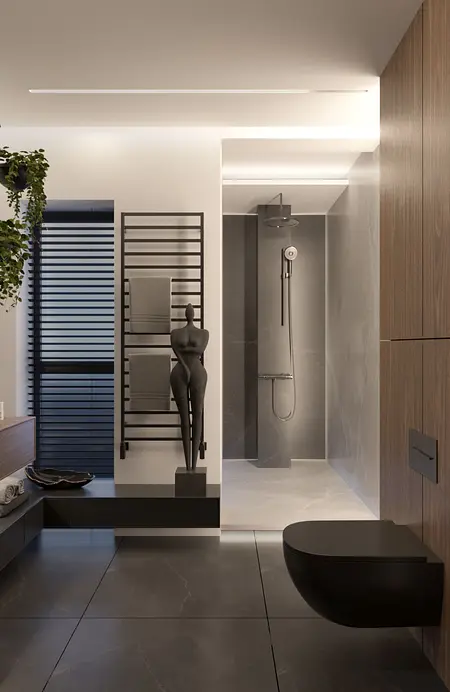 Nowoczesna łazienka z minimalistycznym wystrojem, szarymi i czarnymi elementami.