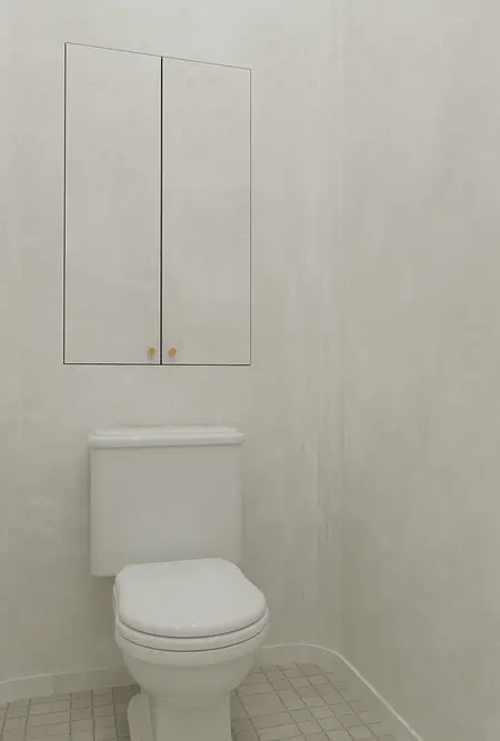 Toaleta z białą muszlą, szarymi ścianami i minimalistycznymi detalami art deco.