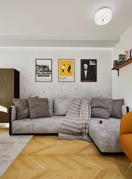 Wnętrze salonu z szarym narożnikiem i drewnianą podłogą, w stylu nowoczesnym i skandynawskim.