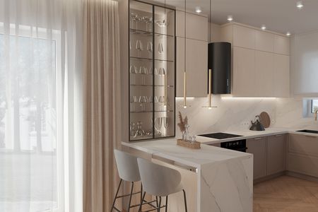 Wnętrze kuchni z beżowymi meblami i marmurowym blatem, styl dopamine decor