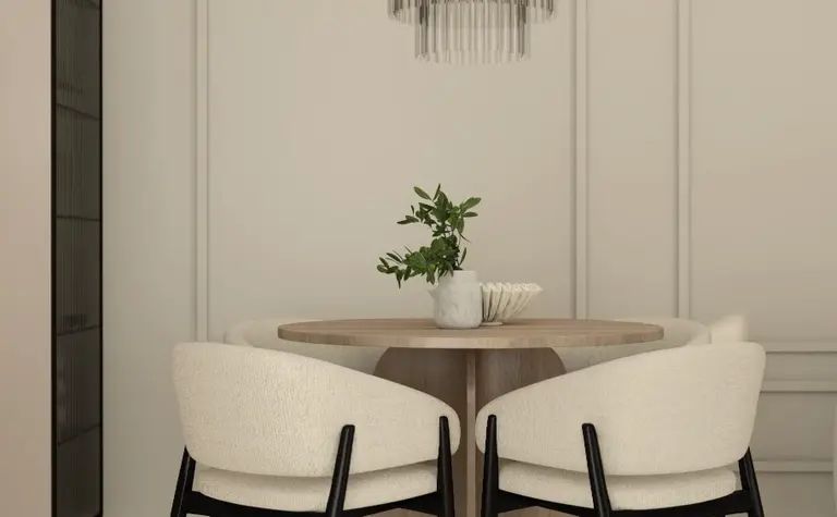 Wnętrze jadalni z okrągłym drewnianym stołem i nowoczesnymi krzesłami w quiet luxury.