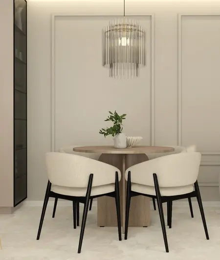 Wnętrze jadalni z okrągłym drewnianym stołem i nowoczesnymi krzesłami w quiet luxury.