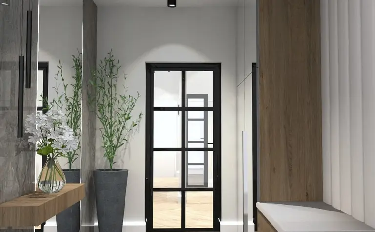 Przedpokój w stylu minimalistycznym z drewnianymi meblami i roślinami.