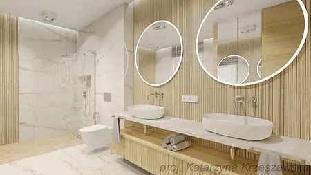 Nowoczesna łazienka z drewnianymi detalami i okrągłymi lustrami.