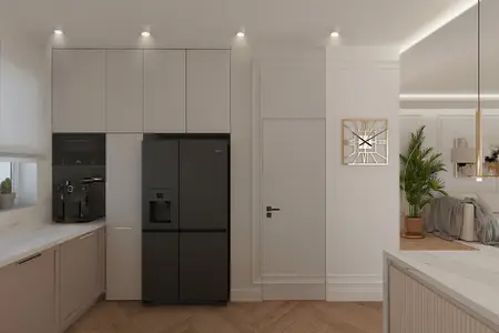 Wnętrze nowoczesnej kuchni z czarną lodówką i jasnymi meblami w stylu dopamine decor.