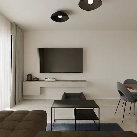 Współczesny salon z telewizorem, minimalistycznymi meblami i szarymi akcentami.