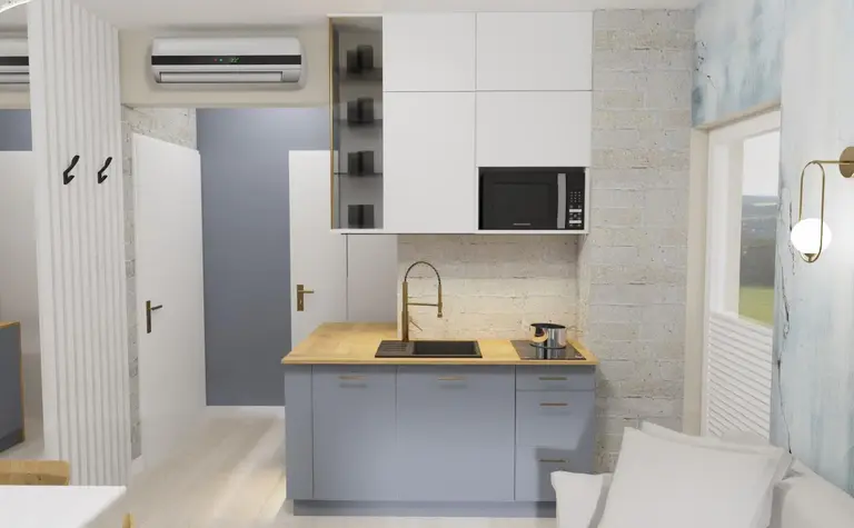 Wnętrze kuchni z szarymi meblami i drewnianym blatem, minimalistyczny design.