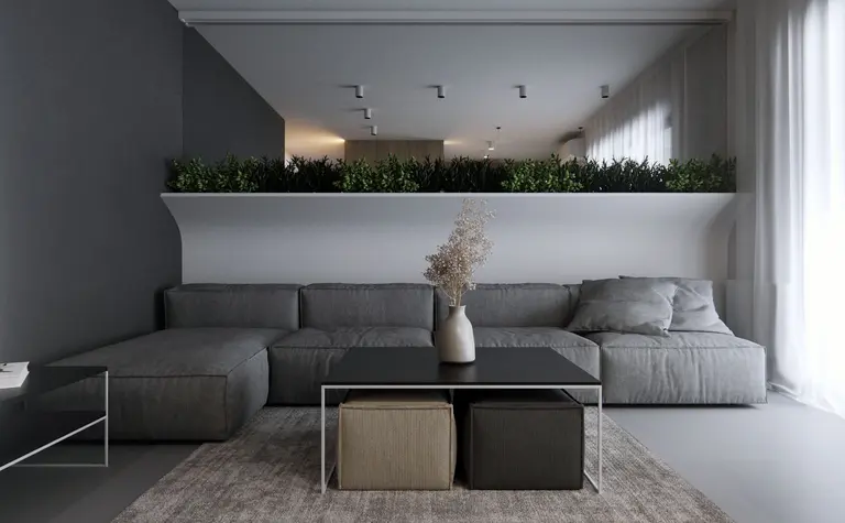 Wnętrze salonu w stylu eklektycznym i minimalistycznym z szarym narożnikiem i roślinami.