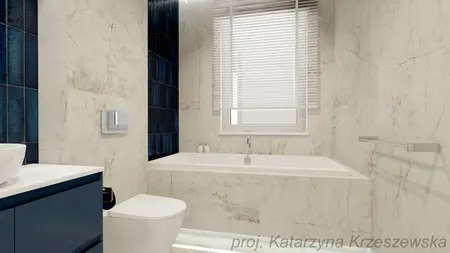 Wnętrze łazienki z białymi kafelkami i granatowymi płytkami, nowoczesny design.