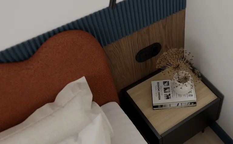 Współczesna sypialnia z brązowym łóżkiem i drewnianym stolikiem nocnym.