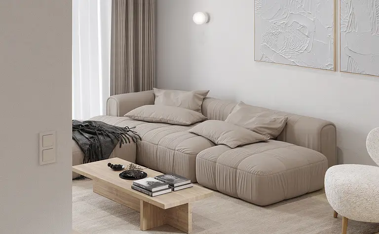 Wnętrze salonu w stylu japandi z minimalistycznymi meblami i naturalnymi materiałami.