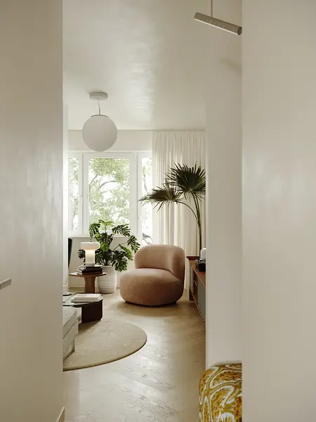 Wnętrze w stylu industrialnym, minimalistycznym z różowym fotelem i roślinami.