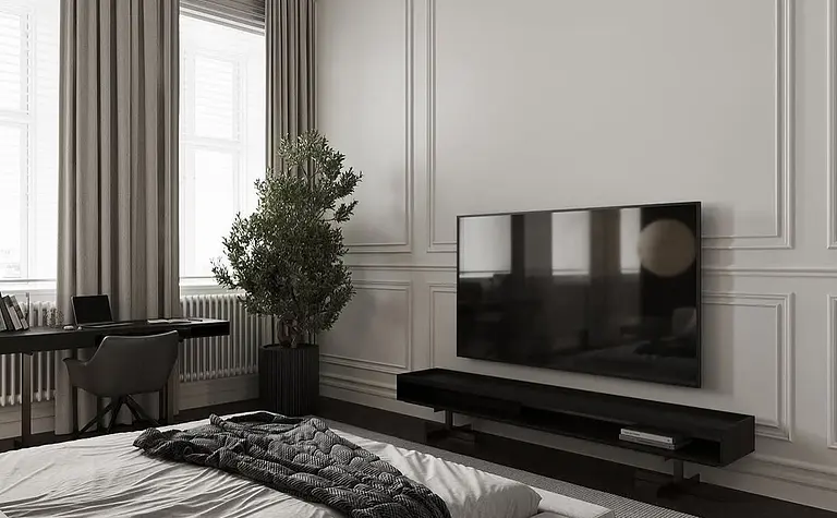 Minimalistyczne wnętrze sypialni z telewizorem, szaro-białymi dodatkami i rośliną
