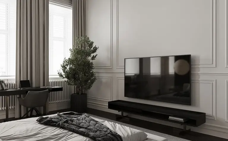 Minimalistyczne wnętrze sypialni z telewizorem, szaro-białymi dodatkami i rośliną