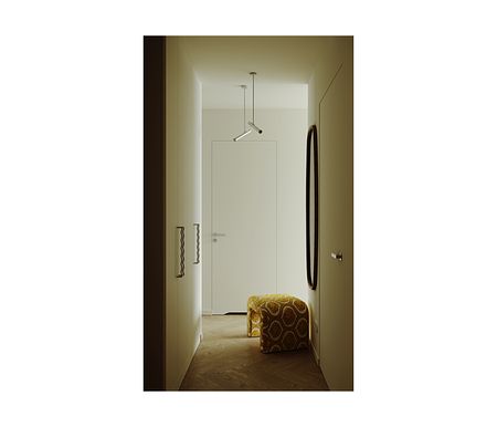 Przedpokój w stylu industrialnym i minimalistycznym z białymi ścianami i żółtym pufem.