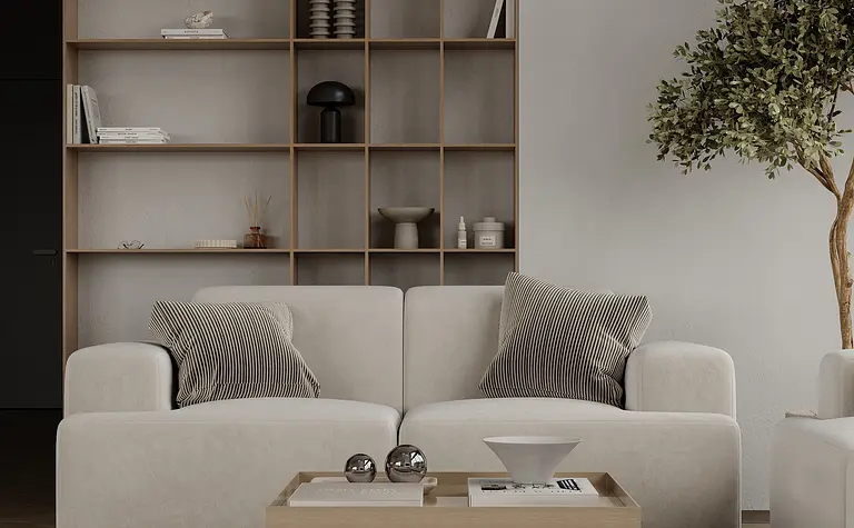 Wnętrze salonu w stylu japandi z minimalistycznym wystrojem, jasną sofą i drewnianymi akcentami.