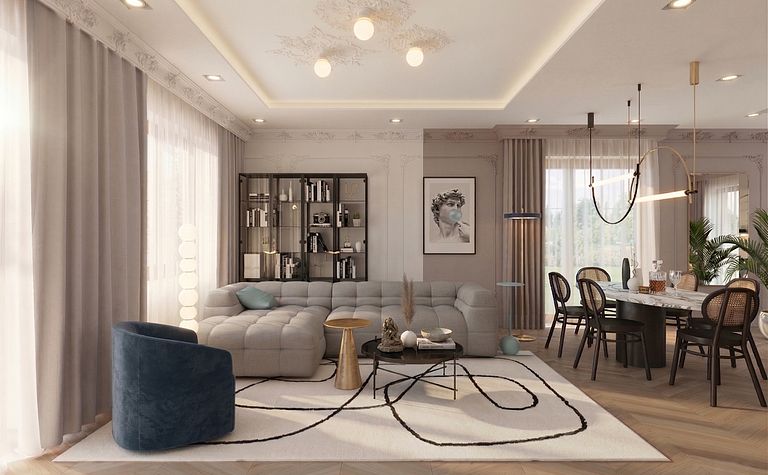 Wnętrze salonu z art deco, glamour i soft minimalizmem, z beżową kanapą i szklanym stolikiem.