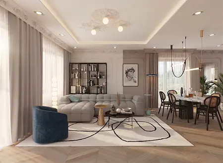 Wnętrze salonu z art deco, glamour i soft minimalizmem, z beżową kanapą i szklanym stolikiem.