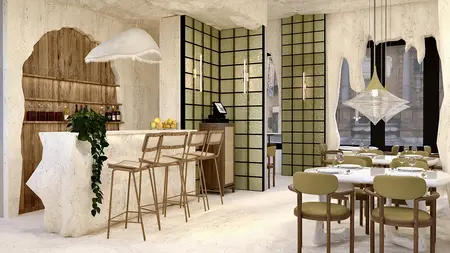 Restauracja w stylu japandi i minimalistycznym z drewnianym barem i jasnymi meblami.