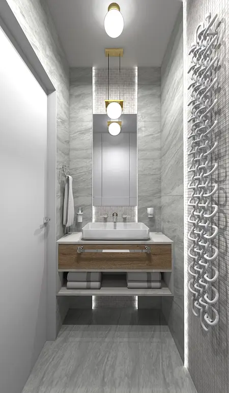 Nowoczesna łazienka z szarymi płytkami, drewnianą szafką i designerskim oświetleniem.