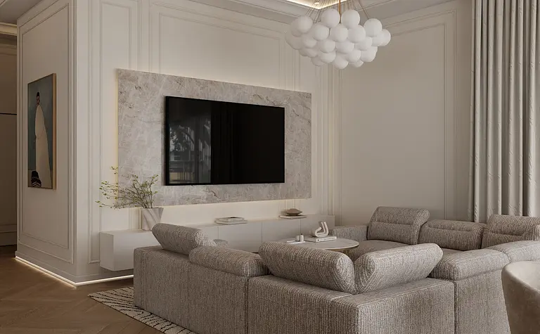 Wnętrze salonu w stylu glamour z szarymi meblami i białymi dodatkami.