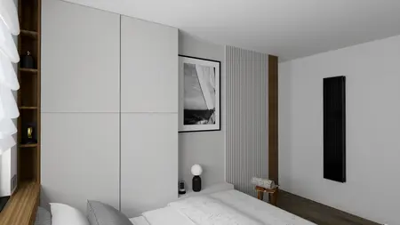 Wnętrze sypialni z minimalistycznym designem, szare meble i nowoczesne akcesoria.