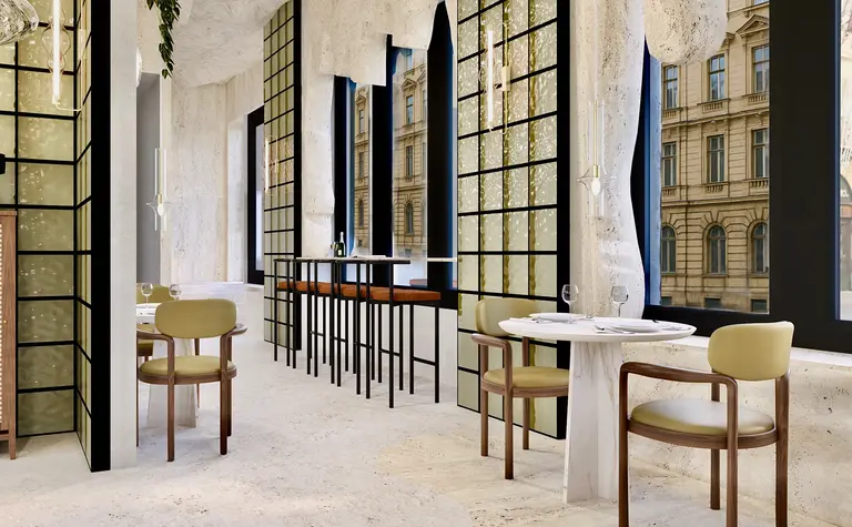 Wnętrze restauracji w stylu japandi i minimalistycznym z jasnymi meblami.